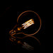 Kooldraadlamp Bol XL G125 Ø12,5cm E27 LED 6W goldline, dimbaar - Amberkleurig glas